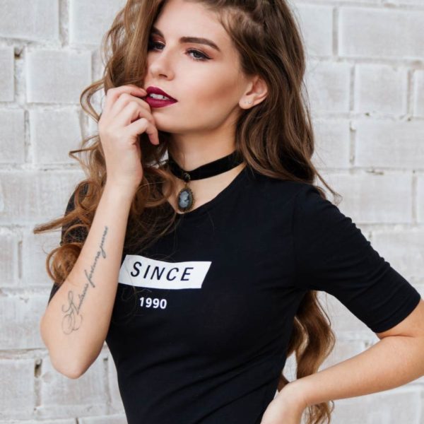 woman posing in a black Tshirt