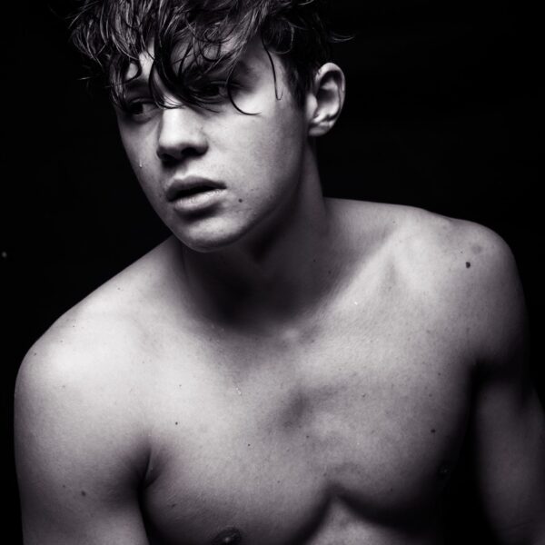 male flaunting his body