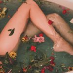 female legs showing in a bathtub full of flowers and leaves-LightSheet Duet machine